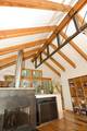 Trestlewood II Timber Frame / This is an interesting composite steel and wood frame Trestlewood II Timber Frame / This is an interesting composite steel and wood frame