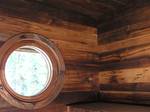 Unique Window framed by Reclaimed Chestnut Paneling - Jackson, Wyoming