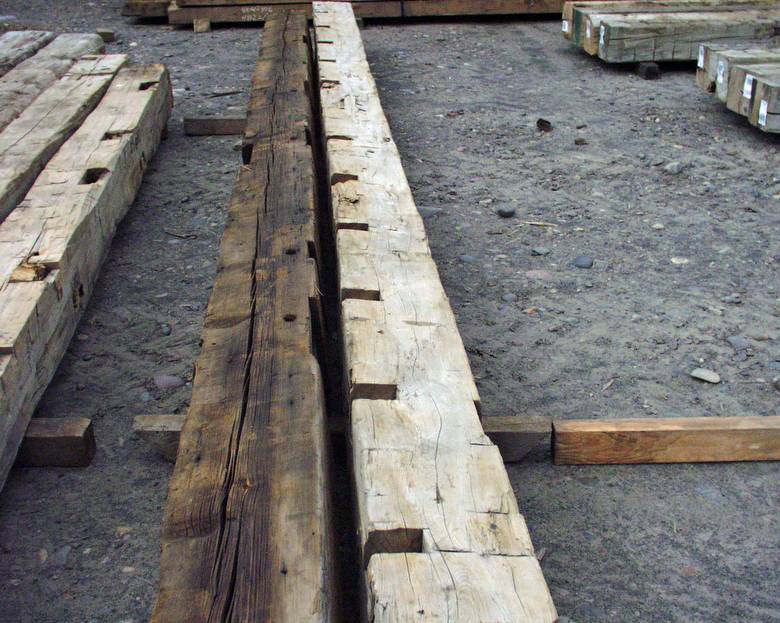 Hand Hewn Timbers / Long timbers, notches on one edge of timber on right