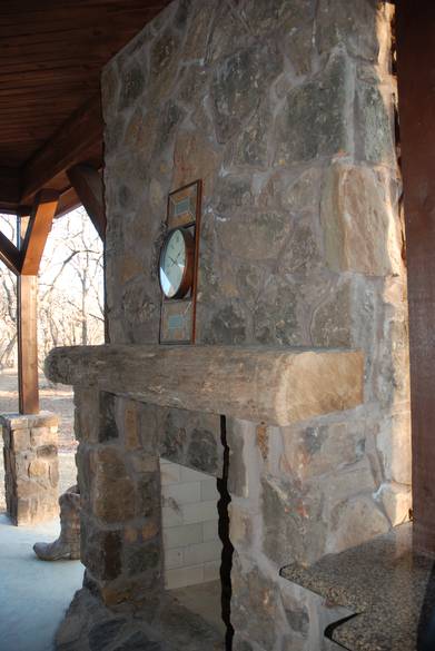 Hand Hewn Mantel on Outdoor Fireplace