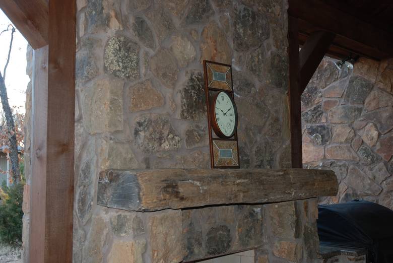 Hand Hewn Mantel on Outdoor Fireplace