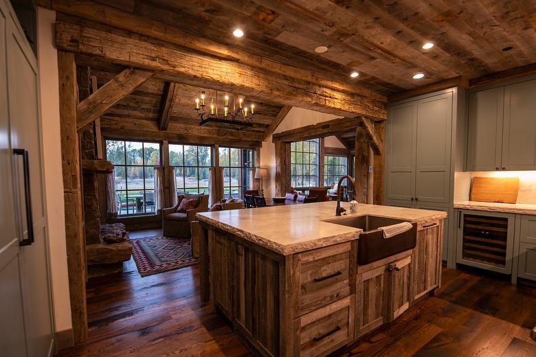 Hand-Hewn Timbers and Antique Barnwood T & G Ceiling and Antique Barnwood Island