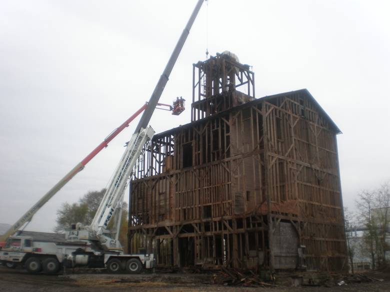 Exterior of Grain Elevator after Removal of Siding / The big crane was brought in to remove the top section