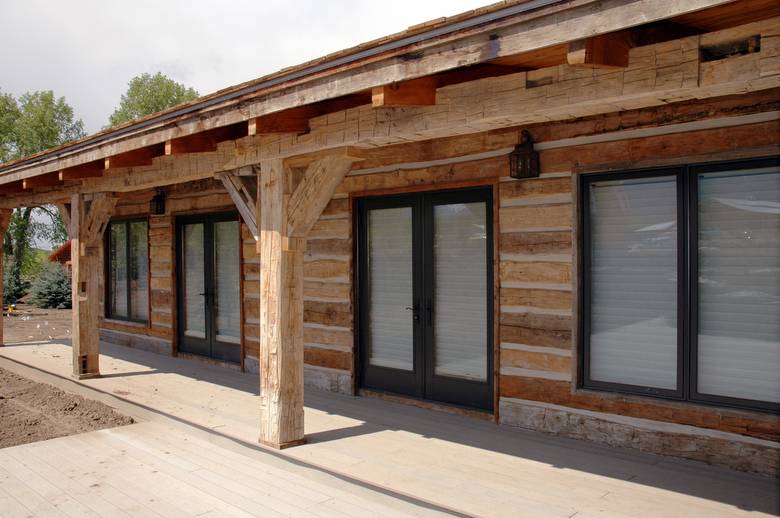 Hand-Hewn Timbers and Skins / Shown are authentic hand-hewn timbers and hand-hewn skins siding
