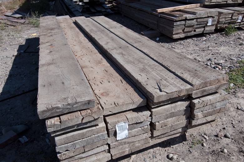 This photo shows 2x10 material - This specific batch of rescued coverboard has some cool characteristics: note the bug tracks, wane, C-S marks