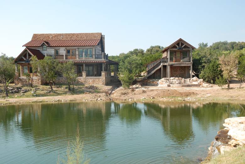 Residence and Garage/Guest Quarters viewed across the water