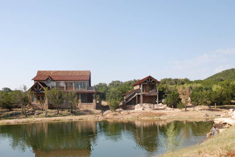 Residence and Garage/Guest Quarters viewed across the water