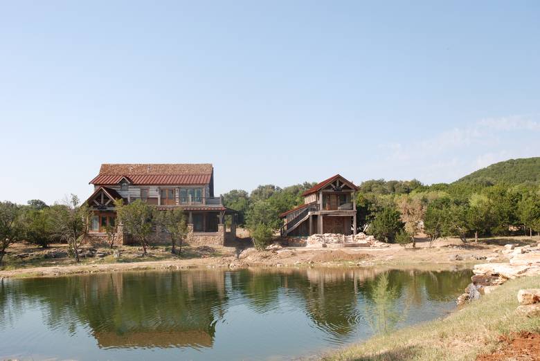 Residence and Garage/Guest Quarters viewed across the water