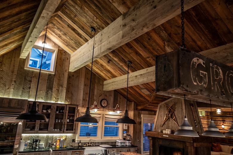 NatureAged beam wraps, paneling and cabinets. Antique Barnwood Gray/Brown ceiling, Trailblazer Skip-Planed flooring (60% Skipped), and Hand-Hewn Skins paneling (pressure washed)