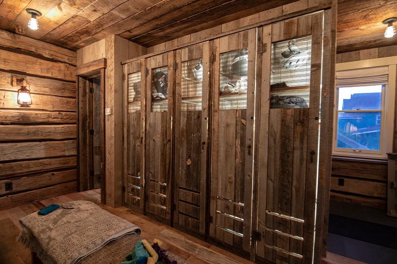 NatureAged beam wraps, paneling and cabinets. Antique Barnwood Gray/Brown ceiling, Trailblazer Skip-Planed flooring (60% Skipped), and Hand-Hewn Skins paneling (pressure washed)