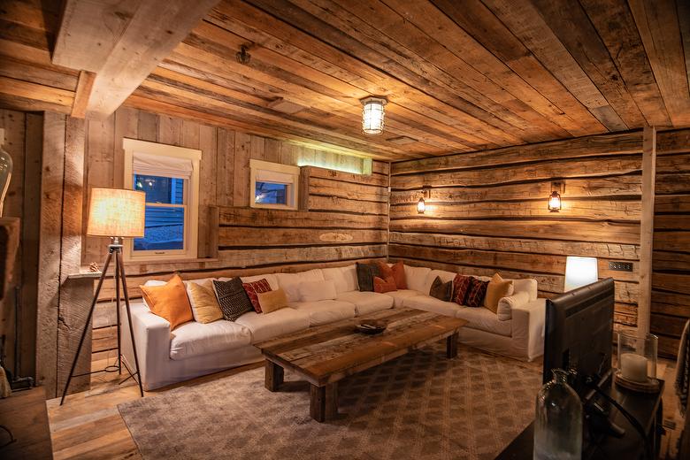 NatureAged beam wraps, paneling and cabinets. Antique Barnwood Gray/Brown ceiling, Trailblazer Skip-Planed flooring (60% Skipped), and Hand-Hewn Skins paneling (pressure washed)