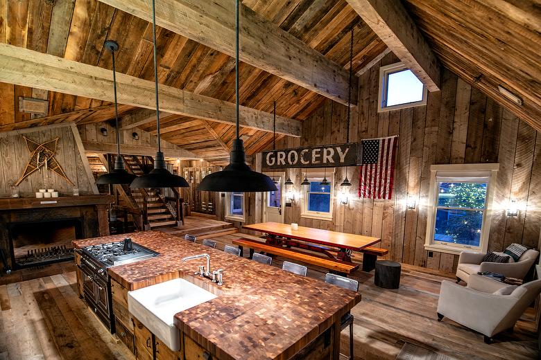 NatureAged beam wraps, paneling and cabinets. Antique Barnwood Gray/Brown ceiling, Trailblazer Skip-Planed flooring (60% Skipped), and Hand-Hewn Skins paneling (pressure washed)