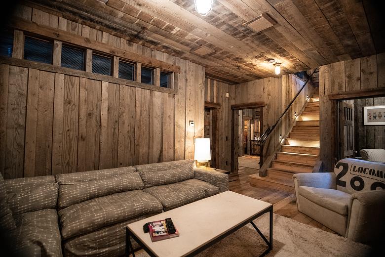 NatureAged beam wraps, paneling and cabinets. Antique Barnwood Gray/Brown ceiling, Trailblazer Skip-Planed flooring (60% Skipped), and Hand-Hewn Skins paneling (pressure washed)