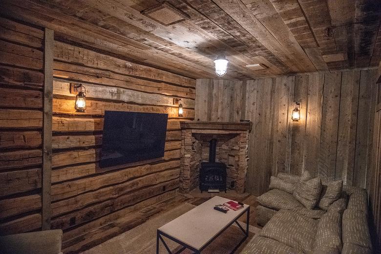 NatureAged beam wraps, paneling and cabinets. Antique Barnwood Gray/Brown ceiling, Trailblazer Skip-Planed flooring (60% Skipped), and Hand-Hewn Skins paneling (pressure washed)