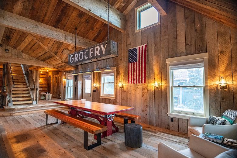 NatureAged beam wraps, paneling and cabinets. Antique Barnwood Gray/Brown ceiling, Trailblazer Skip-Planed flooring (60% Skipped), and Hand-Hewn Skins paneling (pressure washed)