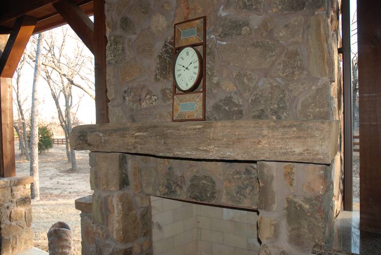 Hand Hewn Mantel on Outdoor Fireplace