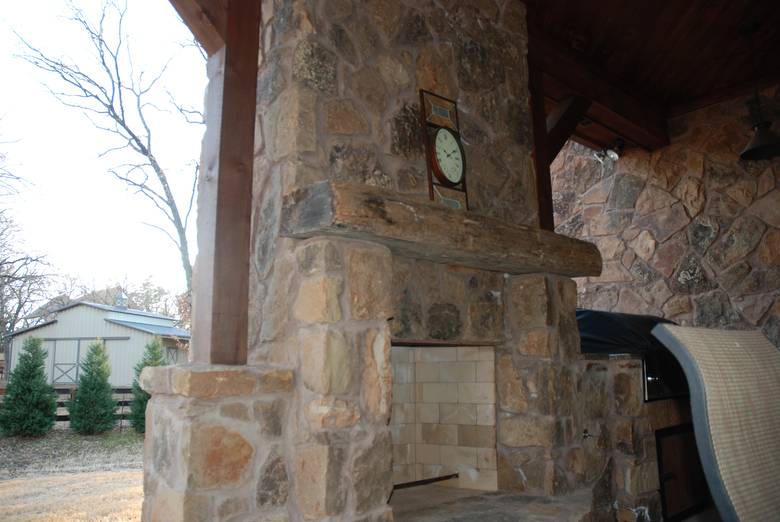 Hand Hewn Mantel on Outdoor Fireplace