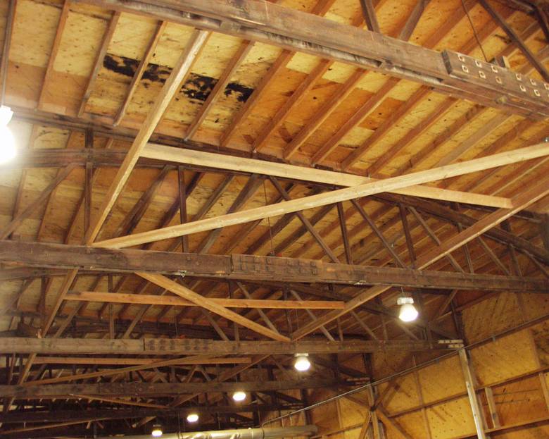 Reclaimed Trusses / TWII C-S Lumber and 59' Bowstring Trusses