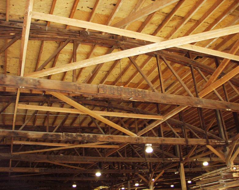 Reclaimed Trusses / TWII C-S Lumber and 59' Bowstring Trusses