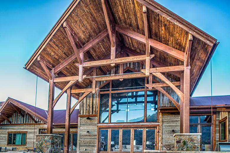 Hand-Hewn Weathered Middles and Mushroomwood Lumber in Entry Ceiling