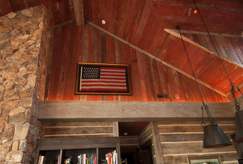 Red Painted Barnwood Ceiling and 1" Hewn Skins Siding