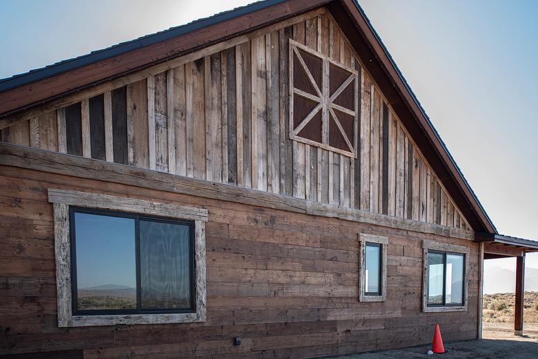 Antique Smooth Brown Barnwood Shiplap Siding, Picklewood Bottoms Board-and-Bat Siding, and Hand-Hewn Timbers