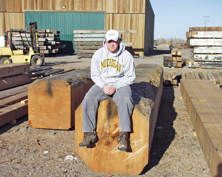 Large DF timbers / 5'10 worker helping show size of timbers