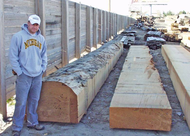 Large DF timbers / 5'10 worker helping show size of timbers