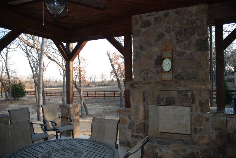 Hand Hewn Mantel on Outdoor Fireplace