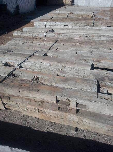 All of these hewn timbers are cut on one face (hidden)