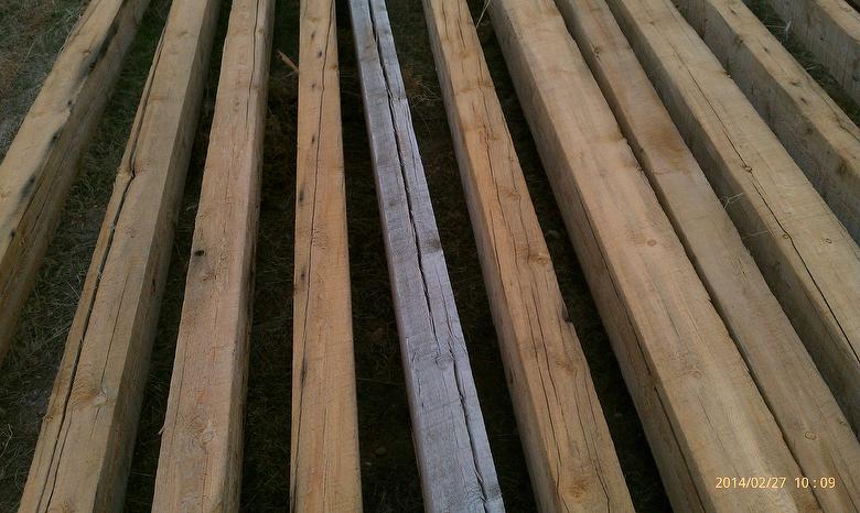 Potato Pole Timbers (cut from poles and then weathered); typically, top face is most weathered, bottom face is least weathered and middle sides are in between; middle timber has been turned over to show most weathered face