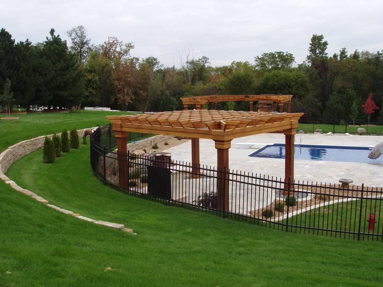 Pergola and Pool / The pergola over the outdoor fireplace is old-growth redwood and cypress