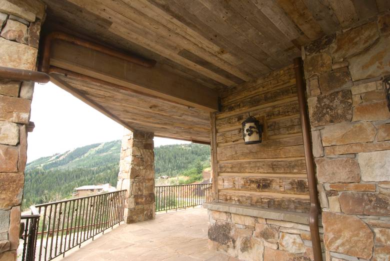 Porch View / Hand-Hewn Siding and Facia. Barnwood T&G Soffit