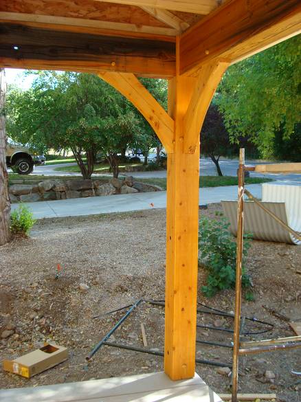 Timberframed porch / Rescued fir post, TWII beams, knee braces