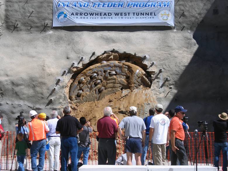 Tunnel Boring Machine breaking through a mountain face to finish Arrowhead Tunnel Project