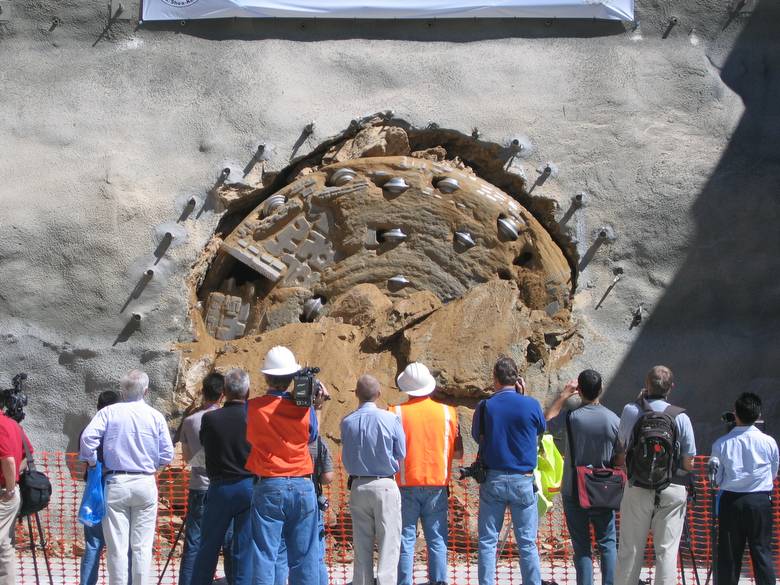 Tunnel Boring Machine breaking through a mountain face to finish Arrowhead Tunnel Project