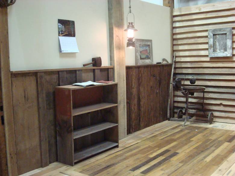 Red painted barnwood bookshelf, barnwood wanescot / Greenheart flooring