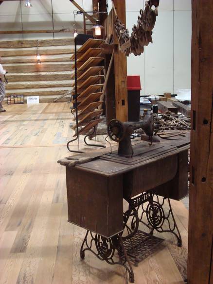 Antique sowing machine, Pine rough-sawn timber fra / barn frame booth at the Indy Home Show