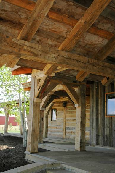 Hand-Hewn Timbers Entryway / The entryway of this home is constructed with authentic hand-hewn timbers